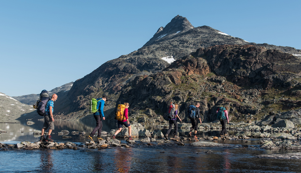 Crossing A River The Peak Uranostind In The Background